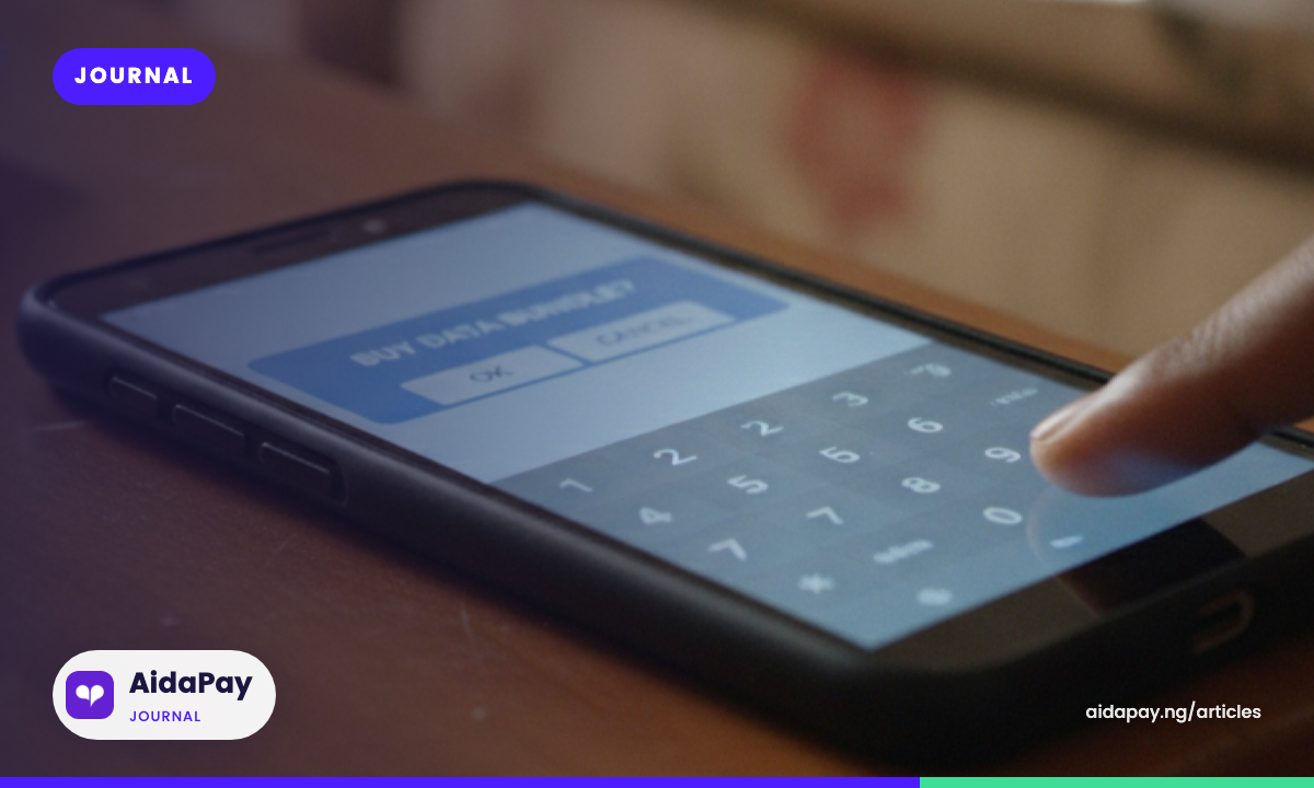 Smartphone on a table showing a USSD pop-up for buying an MTN Odiiche, Oyato or Daban bundle, a thumb about to tap the keypad